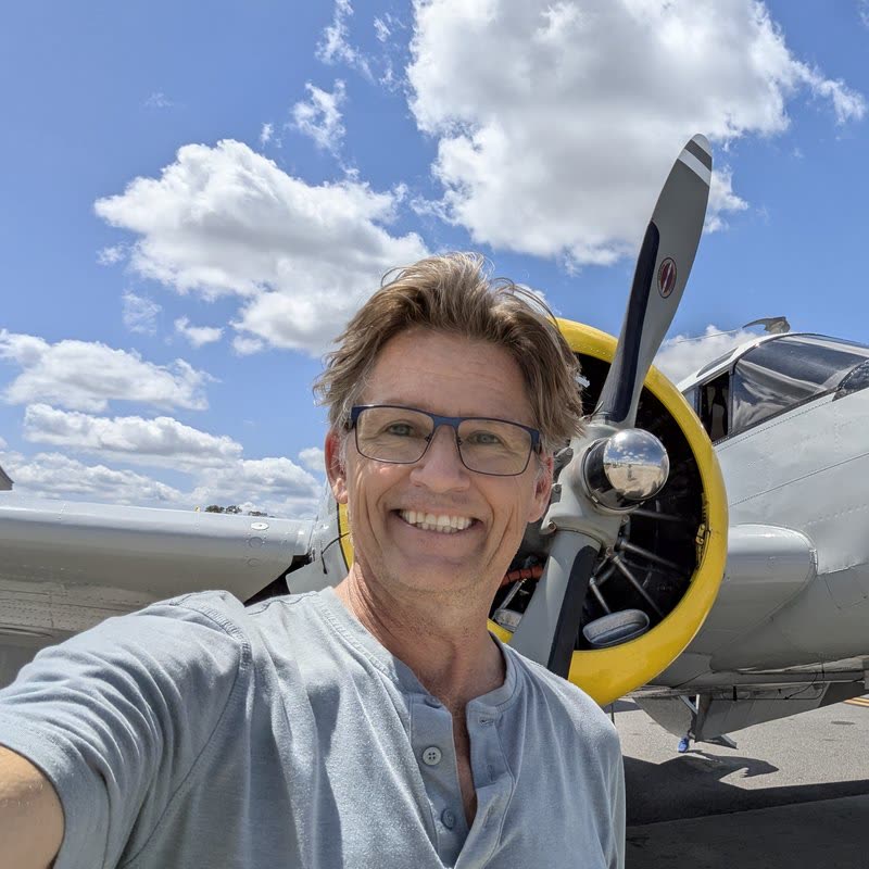 Russell with a radial-engine plane