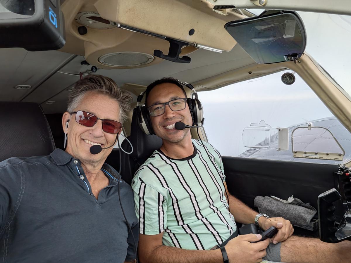 Russell in the cockpit with a student