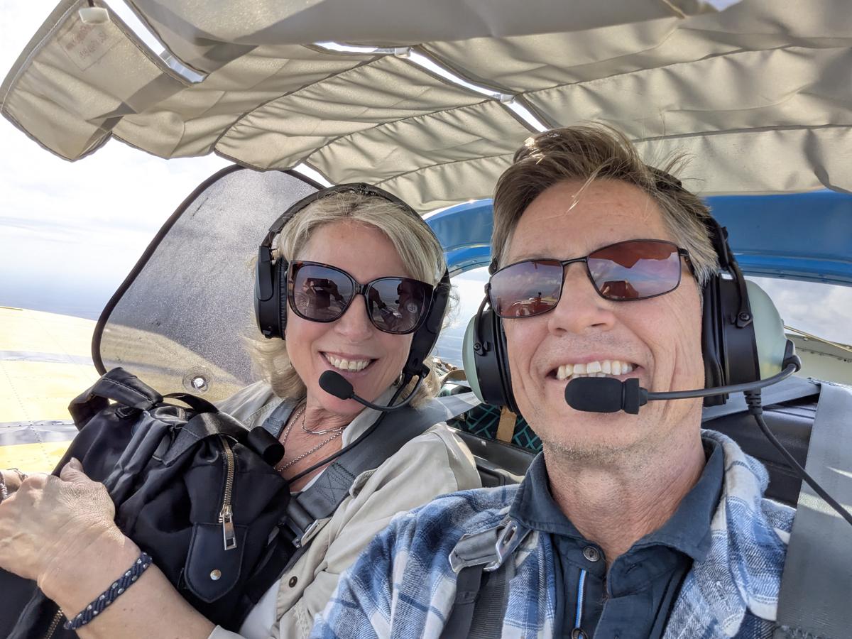 Russell in the cockpit with a student