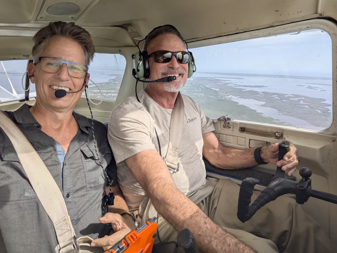 Russell in the cockpit with a student