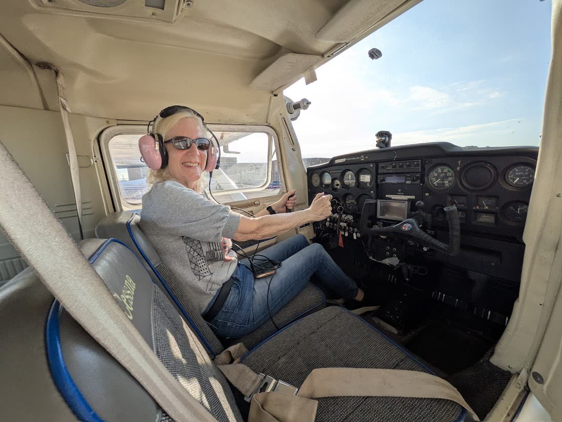 Russell in the cockpit with a student
